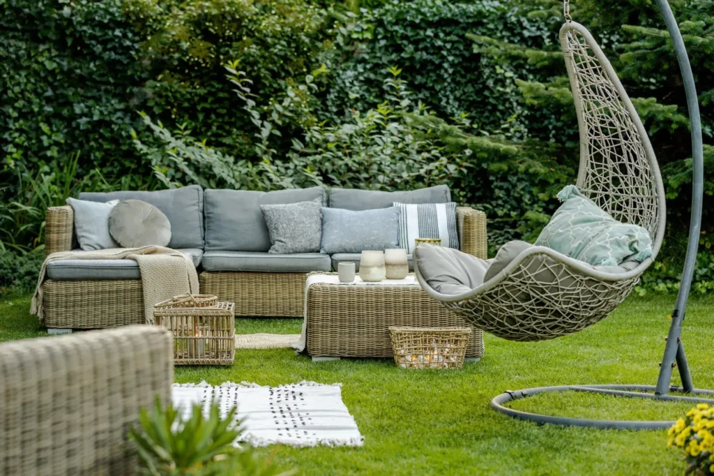 comfortable-wicker-garden-furniture-with-grey-pillows-beautiful-backyard (1) - Guides Blog